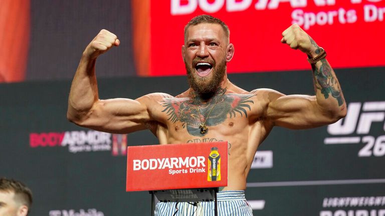 LAS VEGAS, NV - JULY 09: Conor McGregor steps on the scale in front of a packed house at the UFC 264 ceremonial weigh-in at T-Mobile Arena on July 9, 2021 in Las Vegas, NV, United States. (Photo by Louis Grasse/PxImages/Icon Sportswire) (Icon Sportswire via AP Images)