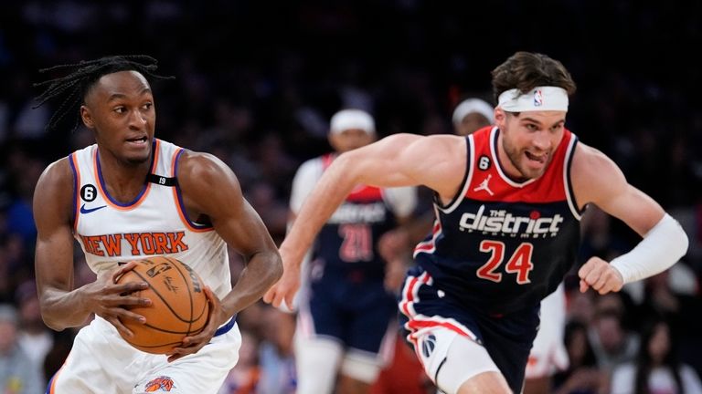 New York Knicks&#39; Immanuel Quickley (5) drives past Washington Wizards&#39; Corey Kispert (24) during the first half of an NBA basketball game Sunday, April 2, 2023, in New York